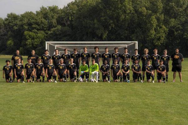 a group of football players posing for a photo